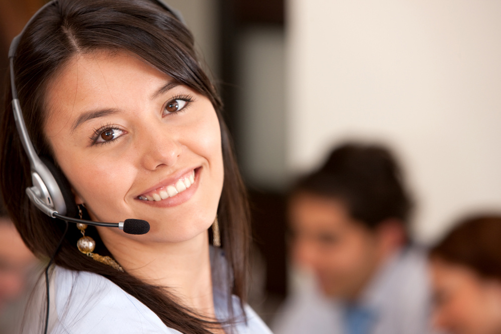 customer support operator smiling in an office